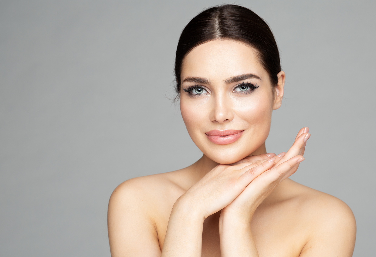 Woman with fuller lips after dermal filler treatment.
